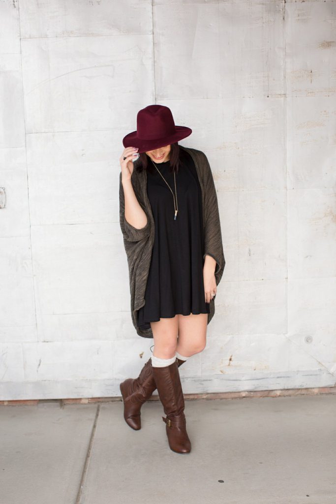 black piko dress brown boots hat