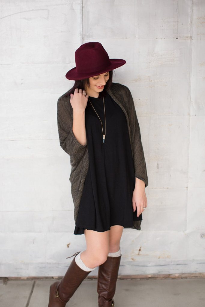 black piko dress brown boots hat
