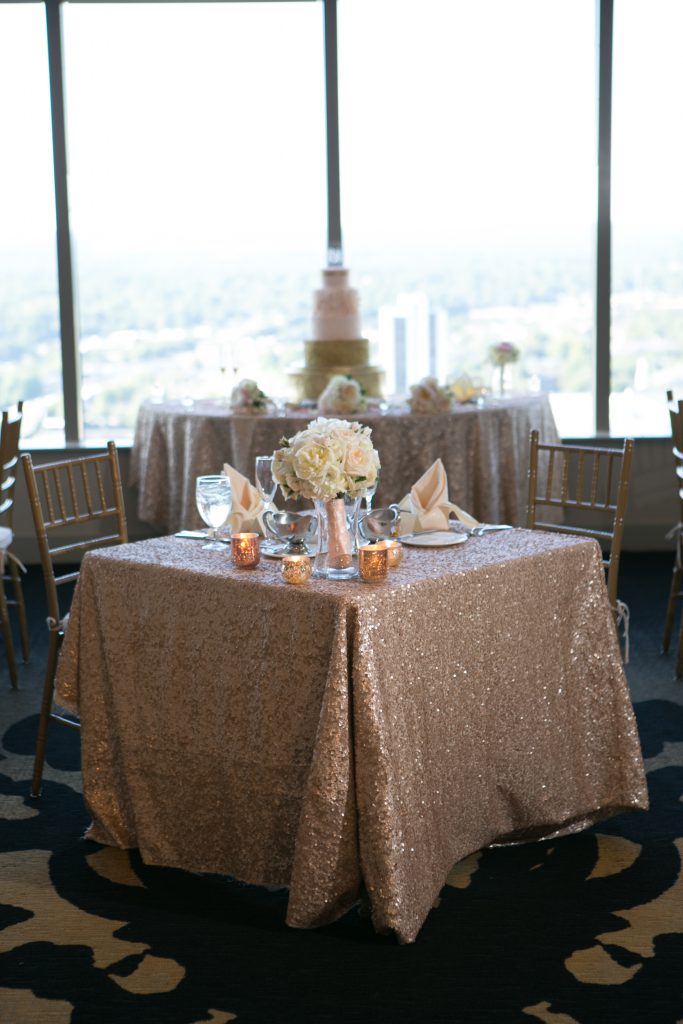 wedding decor, rose gold wedding, city club Raleigh, downtown Raleigh, floating candles, rose tablecloth, capitol club Raleigh, blush and gold themed wedding, sequin tablecloth, Steve Madden gold heels, open bar wedding, unplugged wedding ceremony, wedding bouquet, m & m wedding favors, halo engagement ring, rose gold themed wedding