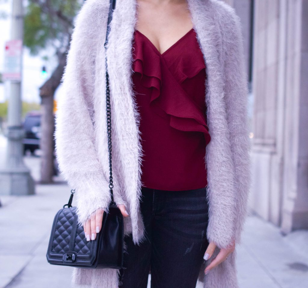 burgundy ruffle top, ruffle top, Valentine's day outfit, date night outfit, valentine's day lookbook, rebecca minkoff, frayed hem jeans, baublebar earrings